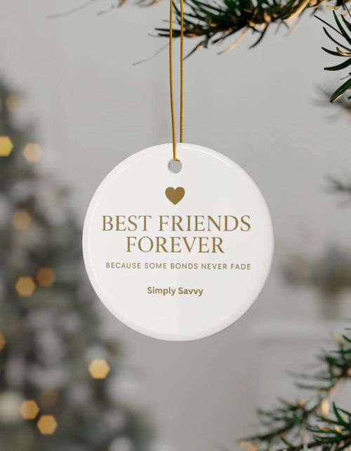 Load image into Gallery viewer, Best Friends Forever ceramic ornament with ‘Because Some Bonds Never Fade’ inscription

BFF keepsake ceramic ornament for friendship with meaningful quote

Friendship ceramic ornament with Best Friends Forever gold lettering and quote

Decorative BFF ceramic ornament with ‘Because Some Bonds Never Fade’ text
