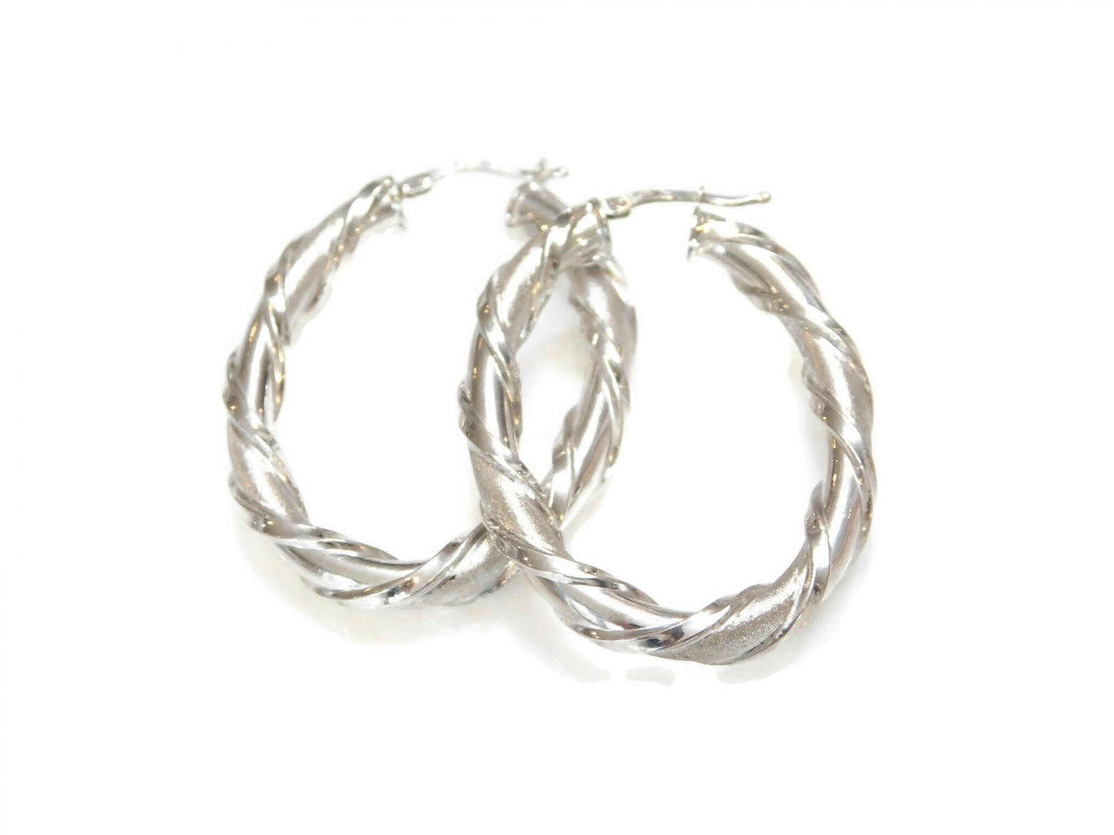 Simply Savvy “Twisted Radiance” Dobbs Sterling Silver Hoop Earrings