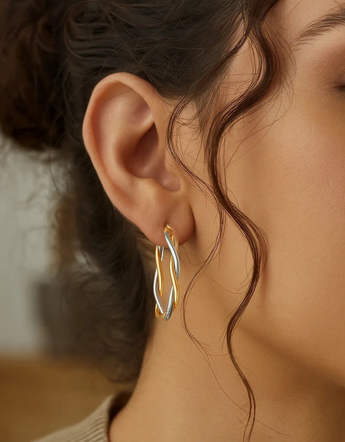 Load image into Gallery viewer, 10K Two Tone Gold Oval Twist Hoop Earrings
