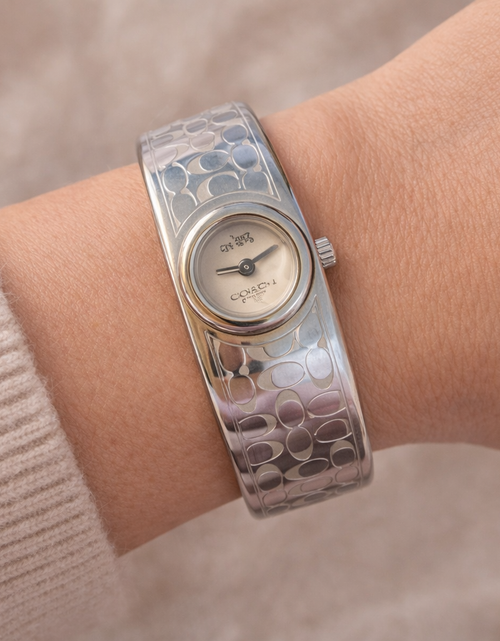 Load image into Gallery viewer, Coach Signature Silver Tone Cuff Watch – Pre-Owned Designer Bracelet Watch
